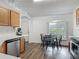 Functional kitchen featuring wood cabinets, stainless steel appliances, an eating area, and lots of natural light at 400 Landress Ln, Deland, FL 32724