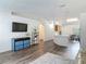 The living room has an open floor plan with a TV, shelving, and an adjacent breakfast nook at 400 Landress Ln, Deland, FL 32724