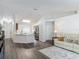 Spacious living room with an open kitchen and an adjacent dining area at 400 Landress Ln, Deland, FL 32724