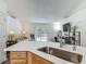 Open-concept living room with sliding glass doors that lead to a private pool at 400 Landress Ln, Deland, FL 32724