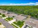Scenic aerial view of homes, showcasing well-kept lawns, screened pools, and mature trees at 409 Nowell Loop, Deland, FL 32724
