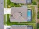 Aerial view of a home featuring a backyard pool and screened enclosure at 409 Nowell Loop, Deland, FL 32724