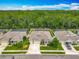 Beautiful aerial view of a neighborhood showcasing lush landscaping and screened-in pools at 409 Nowell Loop, Deland, FL 32724