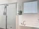 Bathroom features a soaking tub, glass-enclosed shower, white subway tiles, and bright lighting at 409 Nowell Loop, Deland, FL 32724