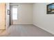 Bright bedroom features soft carpet, a window with blinds, neutral paint, and a decorative painting at 409 Nowell Loop, Deland, FL 32724