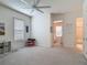 Bright and spacious bonus room with a ceiling fan, natural light, and versatile seating areas at 409 Nowell Loop, Deland, FL 32724