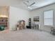 This bonus room offers abundant space for play, a ceiling fan, storage, and a comfortable seating area at 409 Nowell Loop, Deland, FL 32724