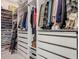 Well-organized walk-in closet with custom shelving, drawers, and ample storage space for clothes and shoes at 409 Nowell Loop, Deland, FL 32724