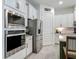 Modern kitchen with stainless steel appliances and ample cabinet space at 409 Nowell Loop, Deland, FL 32724