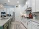 Spacious kitchen with stainless steel appliances, modern finishes, and a granite countertop at 409 Nowell Loop, Deland, FL 32724