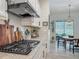 Modern kitchen featuring stainless steel appliances and a view of the patio dining area at 409 Nowell Loop, Deland, FL 32724