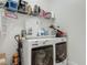 Functional laundry room with white washer and dryer, storage shelves, and ample counter space at 409 Nowell Loop, Deland, FL 32724