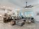 Open-concept living room flows seamlessly into the kitchen and dining areas, perfect for entertaining at 409 Nowell Loop, Deland, FL 32724
