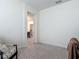 A room with a comfortable seat opens up to a well-designed kitchen and dining area at 409 Nowell Loop, Deland, FL 32724