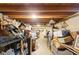 Unfinished basement with exposed wood beams and storage space at 409 S Sparkman Ave, Orange City, FL 32763
