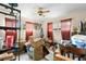 Overstuffed bedroom with a Christmas tree and lots of boxes at 409 S Sparkman Ave, Orange City, FL 32763