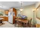 Cozy dining area with a table and chairs, adjacent to the kitchen at 409 S Sparkman Ave, Orange City, FL 32763