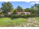 Charming single-story home with well-maintained front yard and mature landscaping at 409 S Sparkman Ave, Orange City, FL 32763