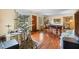 Spacious living room with a drum set, pool table and hardwood floors at 409 S Sparkman Ave, Orange City, FL 32763