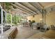 Covered patio with ceiling fan, dining set, and outdoor bar, perfect for entertaining at 409 S Sparkman Ave, Orange City, FL 32763