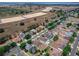 Wide aerial shot showcasing residential homes in a well-designed community with an open space and water feature at 4604 Barbados Loop, Clermont, FL 34711
