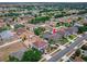 A beautiful aerial view of a home with a screened in pool surrounded by lush landscaping in a quiet neighborhood at 4604 Barbados Loop, Clermont, FL 34711