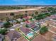 Aerial shot showing a home with a large fenced-in backyard and a screened-in pool in a quiet neighborhood at 4604 Barbados Loop, Clermont, FL 34711