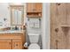 Bathroom with a shower and vanity with granite countertops at 4604 Barbados Loop, Clermont, FL 34711