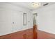 Bright bedroom featuring a chandelier, wood floors, large closet and stylish trim at 4604 Barbados Loop, Clermont, FL 34711