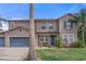 Charming two-story home with well-manicured lawn, mature palms, and a welcoming front porch at 4604 Barbados Loop, Clermont, FL 34711
