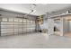 A spacious garage with room for storage featuring an automatic door and an entrance into the house at 4604 Barbados Loop, Clermont, FL 34711