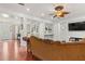 Spacious living room with wood floors, open layout, and decorative accents at 4604 Barbados Loop, Clermont, FL 34711