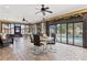 Spacious indoor living area with multiple seating arrangements and easy access to the pool at 4604 Barbados Loop, Clermont, FL 34711