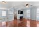 Cozy living room featuring wood floors, neutral paint and ceiling fan at 4604 Barbados Loop, Clermont, FL 34711