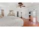 Spacious main bedroom with wood floors and access to ensuite and closets at 4604 Barbados Loop, Clermont, FL 34711
