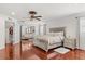Open main bedroom featuring wood floors, a ceiling fan, closet and furnishings at 4604 Barbados Loop, Clermont, FL 34711