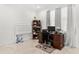 Well-lit home office with a bookshelf and desk, perfect for remote work at 4604 Barbados Loop, Clermont, FL 34711