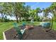 Serene backyard setting with comfortable seating around a fire pit, perfect for outdoor relaxation at 51 Silk Moss Ct, South Daytona, FL 32119