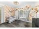 Bedroom room with decor, featuring a crib and playful wallpaper at 51 Silk Moss Ct, South Daytona, FL 32119