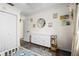 Charming bedroom with white dresser, round mirror, and playful decor creating a delightful space at 51 Silk Moss Ct, South Daytona, FL 32119
