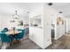 Cozy dining area featuring stylish blue chairs, view into kitchen, and modern decor at 51 Silk Moss Ct, South Daytona, FL 32119