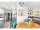 Open kitchen and dining area with stainless steel appliances and stylish blue dining chairs at 51 Silk Moss Ct, South Daytona, FL 32119