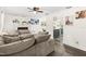 Spacious living room with fireplace, neutral tones, comfortable seating, and view of kitchen at 51 Silk Moss Ct, South Daytona, FL 32119