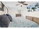 Bright and airy main bedroom with a ceiling fan and wall-mounted TV at 51 Silk Moss Ct, South Daytona, FL 32119