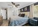 Cozy main bedroom featuring stylish accent wall and ensuite bathroom at 51 Silk Moss Ct, South Daytona, FL 32119