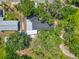 This overhead shot presents the property's roof and expansive yard with tree coverage at 511 Doctors Dr, Oviedo, FL 32765