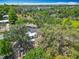 A bird's-eye view highlights the home's setting amidst lush surroundings and nearby community at 511 Doctors Dr, Oviedo, FL 32765