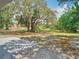 Large, grassy backyard featuring a mature tree at 511 Doctors Dr, Oviedo, FL 32765