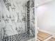 Bathroom featuring marble tile shower with black and white accents at 511 Doctors Dr, Oviedo, FL 32765