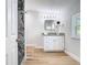 Bathroom featuring new vanity, granite countertops, and natural light at 511 Doctors Dr, Oviedo, FL 32765